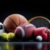 Assorted sports equipment on a glossy surface: basketball, football, tennis racket and balls, golf ball, and a red boxing glove.